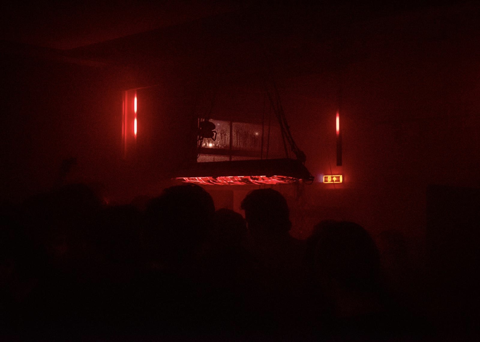 Dark club room glowing in deep red light